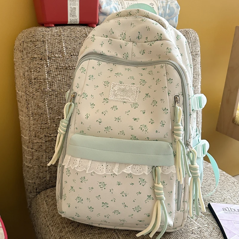 Eleganter Schulrucksack mit Blumendruck und mehreren Fächern
