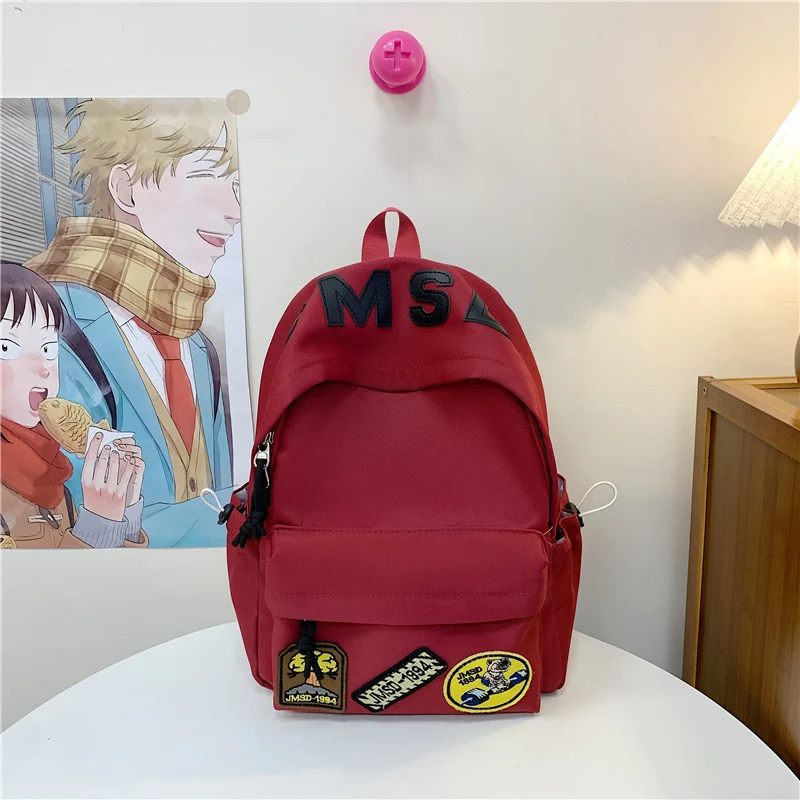 Lustiger Schulrucksack im Themen-Patchwork-Design