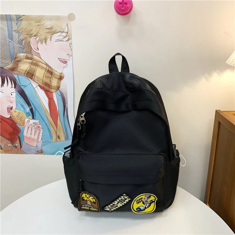 Lustiger Schulrucksack im Themen-Patchwork-Design
