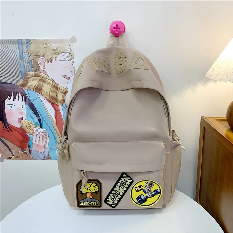 Lustiger Schulrucksack im Themen-Patchwork-Design