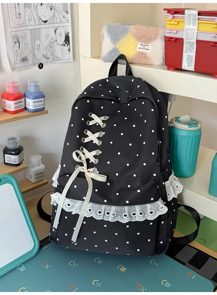 Schulrucksack mit Polka-Dot-Muster und Spitzenbesatz