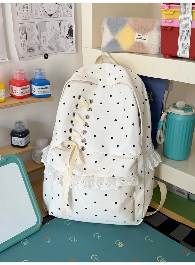Schulrucksack mit Polka-Dot-Muster und Spitzenbesatz