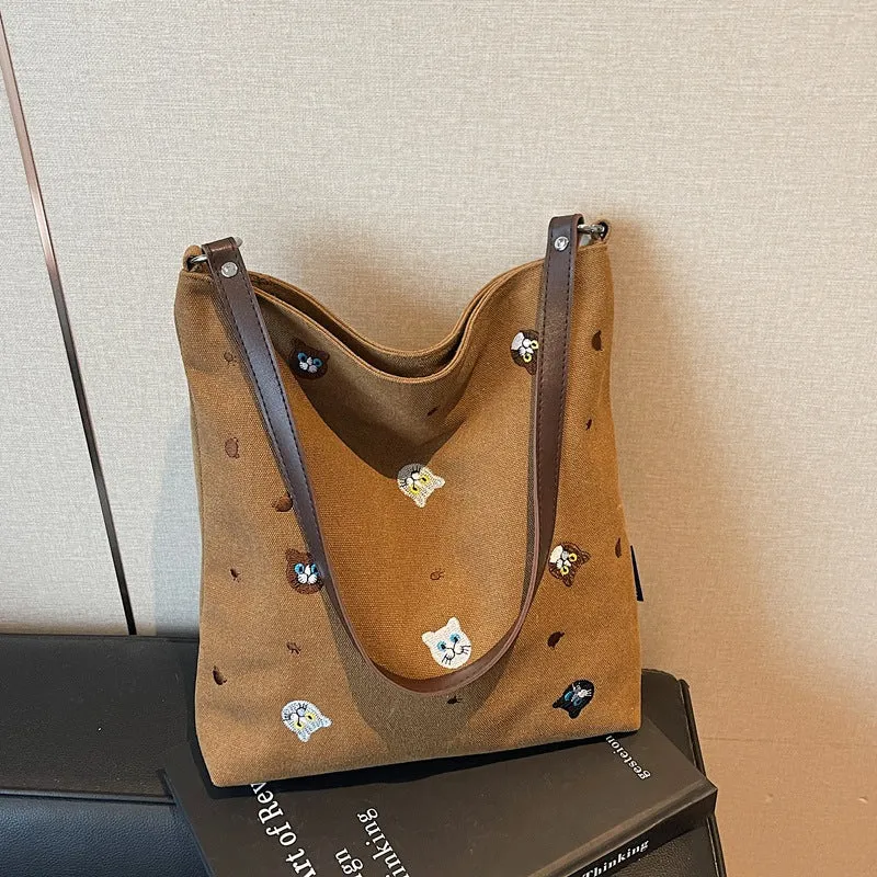 Lustiger Schulrucksack mit gesticktem Charakter