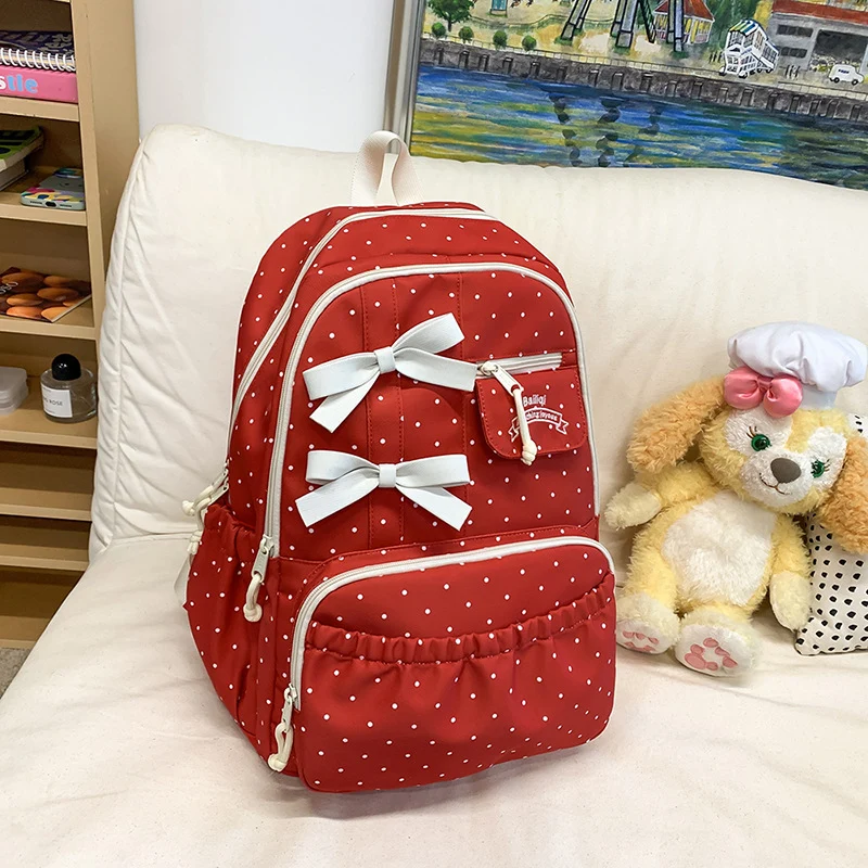 Charmanter Schulrucksack mit Tupfen und Schleife