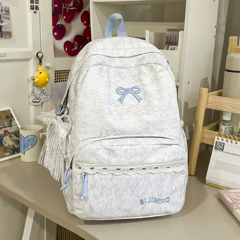 Niedlicher Schulrucksack mit mehreren Fächern und Schleifendekorationen