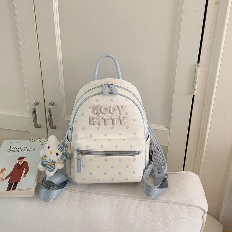 Niedlicher gepunkteter Schulrucksack mit Charakter-Motiv