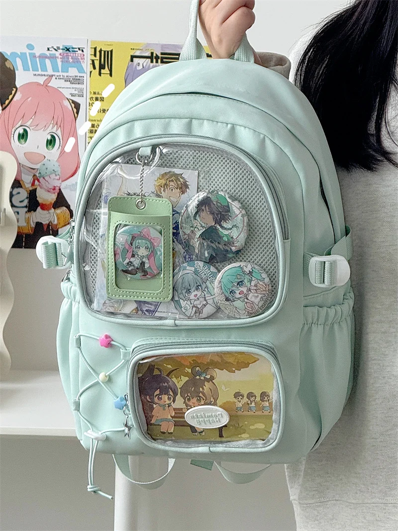 Schulrucksack mit Anime-Charakter-Motiv und transparentem Fach
