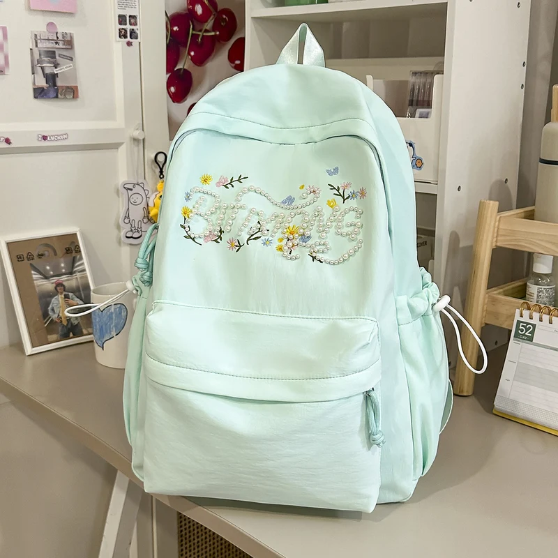 Schulrucksack mit bestickter Blume