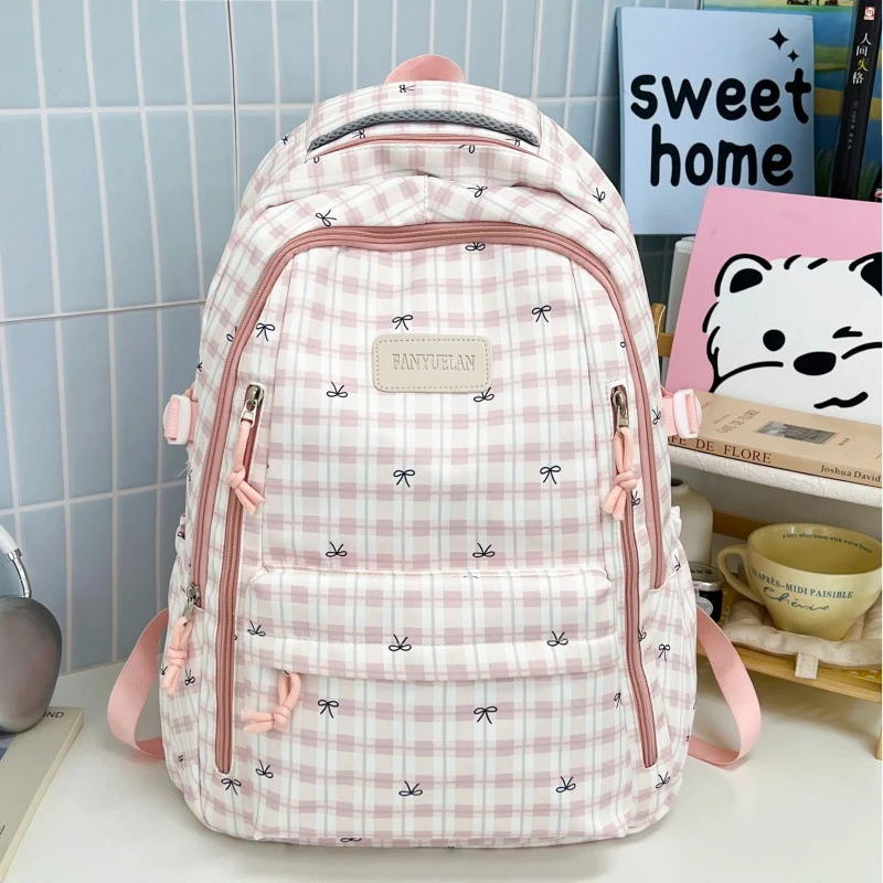 Süßer Schulrucksack mit Schleifenmuster