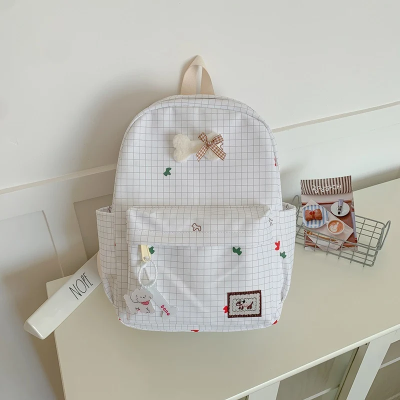 Niedlicher karierter Schulrucksack mit Charakter-Motiv