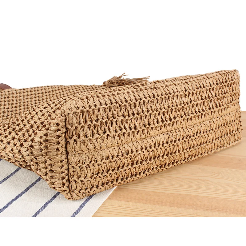 Handtasche aus geflochtenem Naturmaterial mit Quasten-Dekoration Skanto