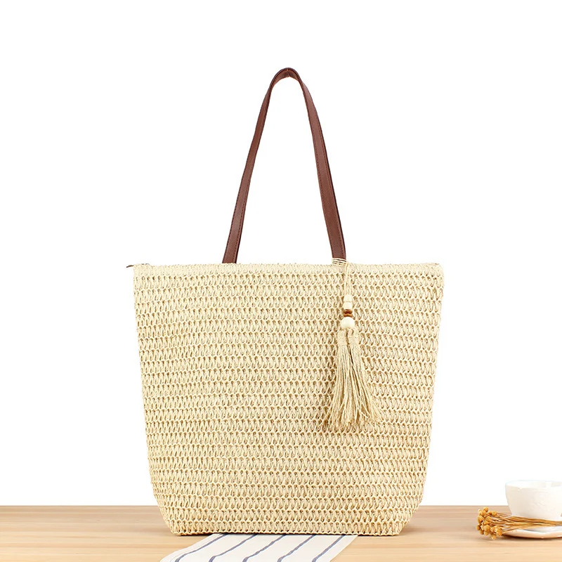 Handtasche aus geflochtenem Naturmaterial mit Quasten-Dekoration Skanto