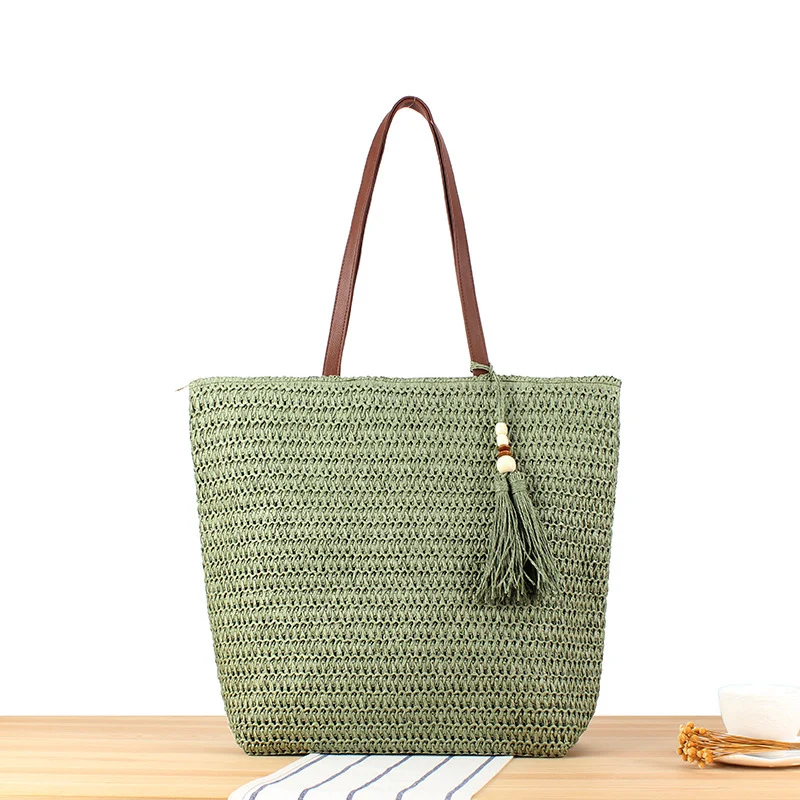 Handtasche aus geflochtenem Naturmaterial mit Quasten-Dekoration Skanto