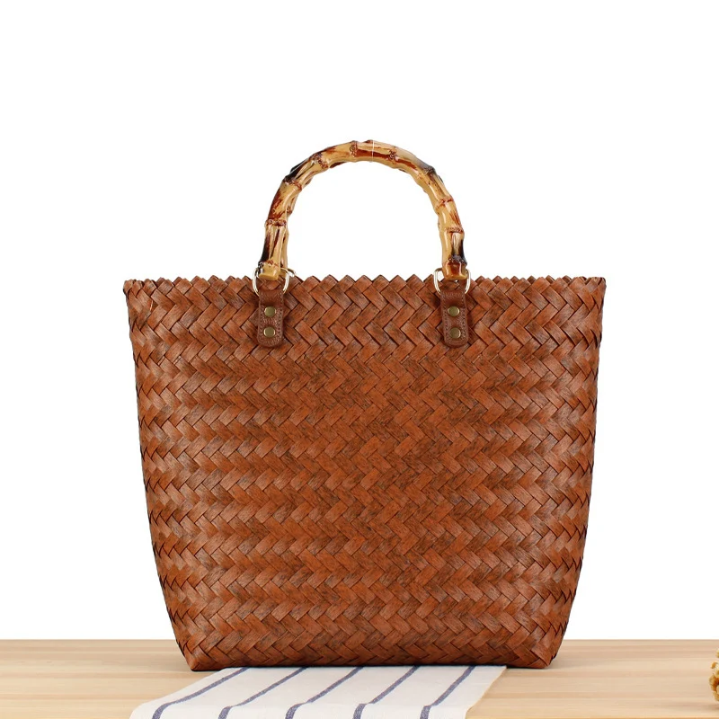 Handtasche aus hochwertigem, geflochtenem Material mit Bambusgriff Skanto