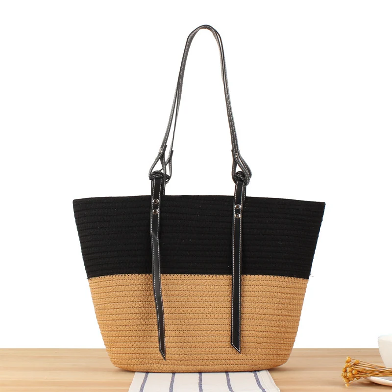 Elegante Strandtasche aus gewebtem Naturmaterial mit stilvollen Lederakzenten Skanto
