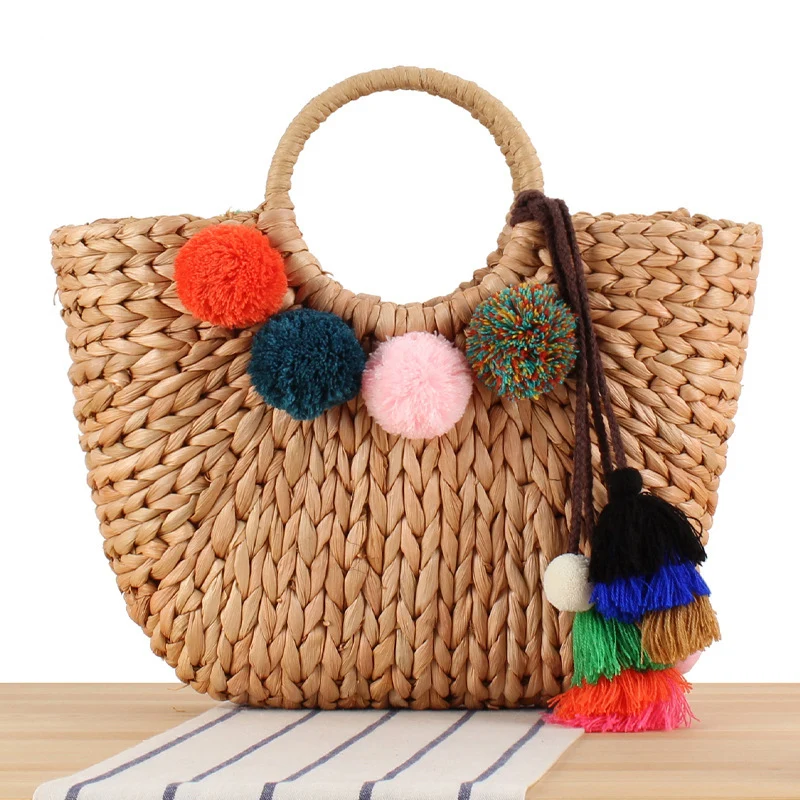 Korbtasche mit bunten Pompons und Griff Skanto